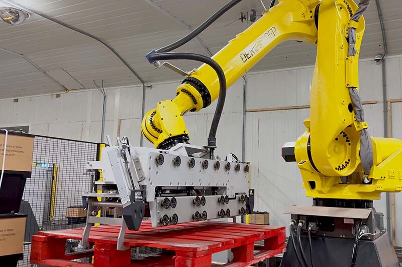 A robot moves a pallet so that Procona can be stacked on it